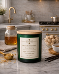 Lunico Dolce Mattina candle on a kitchen counter with kitchen items in the background